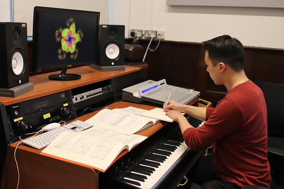 Andrew Chen sitting in an RCM composition suite